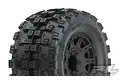 Close-up of a Pro-Line Badlands MX38 HP belted tyre mounted on a black Raid rim, showing the aggressive tread pattern and wheel detail.