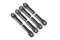 A set of eight black plastic Traxxas heavy-duty rod ends with metal pivot balls inserted, arranged in two rows on a white background.