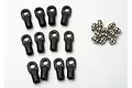 A set of twelve black plastic RC rod ends and twelve small silver metal pivot balls arranged on a white background.