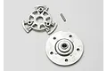 Traxxas slipper clutch pressure plate, hub, and small metal pin on a plain white background.