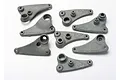A set of grey plastic Traxxas Long Travel rocker arms for RC vehicles, shown from various angles on a white background.