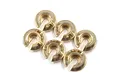A set of six brass high mass spring retainers for RC shock absorbers arranged on a white background.