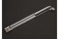 A clear plastic Traxxas centre drive shaft cover for RC vehicles, shown against a dark grey background.