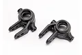 Two black plastic steering hub carriers for a Traxxas RC vehicle, shown from a top-down angle against a white background.