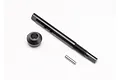 Traxxas input shaft, bearing adapter, and small metal pin for RC drivetrain maintenance.