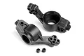 Two black plastic RC car rear hubs and two small metal grub screws on a white background.
