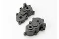 Two black plastic Traxxas gearbox housing halves shown from different angles on a white background.