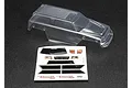 A clear, unpainted polycarbonate body shell for the Traxxas 1/16 Summit RC truck, shown with an included decal sheet on a black background.