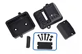 Traxxas sealed receiver box set including black plastic housing components, a blue rubber gasket, screws, and foam padding on a white background.