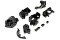 A set of black plastic transmission case parts for an Axial RC vehicle, including housing halves, covers, and small mounting components.