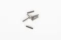 A small pile of six silver metal drive pins for RC vehicles against a plain white background.