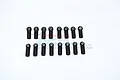 Sixteen black plastic RC turnbuckle ball ends arranged in two rows of eight against a white background with a faint GPM Racing logo watermark.