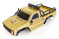 HSP 1/10 scale Pioneer RC crawler body shell in champagne gold with black trim, roll bar, and roof lights on a white background.