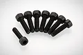Eight black metal cap head screws arranged in a semi-circle on a white background.