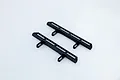 Two black plastic RC car footplates for the HSP Pioneer, shown from an elevated angle on a white background.