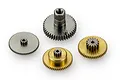 A set of four metal servo gears of varying sizes and materials, including brass and steel, arranged on a plain white background.