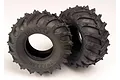 Two black Traxxas Sledgehammer RC monster truck tyres with aggressive tread patterns, shown against a plain white background.