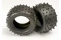 Two black Traxxas 2.2 inch low profile spiked RC tyres shown against a plain white background.