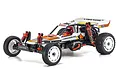 Kyosho Ultima 1/10 scale 2WD electric RC buggy in white, orange, and black livery with white wheels and red shock absorbers.