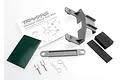 Traxxas battery hold down kit including grey plastic mounts, foam pads, metal posts, and body clips with an instruction sheet.
