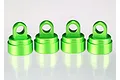 Four bright green anodized aluminium shock caps for Traxxas RC vehicles, arranged in a row against a white background.