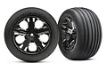 Two Traxxas 2.8 inch ribbed tires mounted on black chrome All-Star rims, shown from front and angled perspectives.