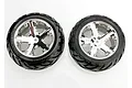 Two Traxxas 2.8 inch Anaconda tires pre-mounted on chrome All-Star rims, viewed from the front against a white background.