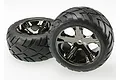 Two Traxxas 2.8 inch Anaconda tires pre-glued onto black chrome All-Star rims, shown against a plain white background.