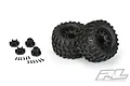 Two Pro-Line 2.8 inch Hyrax RC monster truck tires pre-mounted on black Raid wheels, with included hex adapters and mounting screws on a white background.