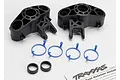 Traxxas 5334R axle carrier set including two black plastic carriers, four blue plastic rings, two black rubber bushings, and an instruction sheet.