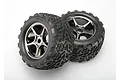 Two Traxxas 3.8-inch Talon tires pre-glued onto black chrome Gemini wheels, shown against a plain white background.