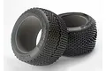 Two Traxxas Pro Response RC monster truck tyres with foam inserts, featuring a knobby tread pattern and black rubber construction.