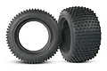 Two black Traxxas Alias 2.8 inch RC monster truck tyres with foam inserts, shown from side and angled views against a white background.