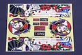 A sheet of Pandora RC vinyl decals featuring Japanese-style courtesan illustrations, fans, flowers, and brand logos on a light yellow backing.