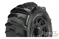 Close-up of a Pro-Line 3.8 inch Dumont paddle tyre mounted on a black Raid rim, showing the aggressive tread pattern and branding.
