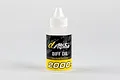 A bottle of Alpha 2000cPs differential oil for RC cars, featuring a white cap and a black and yellow label.