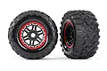 Two Traxxas Maxx 4S all-terrain RC monster truck wheels with black rubber tires and black rims featuring red beadlock-style accents.
