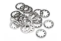 A pile of twenty small silver-coloured metal internal tooth locking washers on a white background.