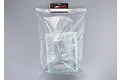 A clear, unpainted 1/10 scale RC car body shell by Killerbody, sealed in a plastic bag with included decal sheets and accessory parts.