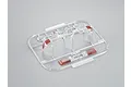 A plastic sprue containing clear and red-painted RC light lenses for a 1/10 scale Toyota Land Cruiser 70 body shell.