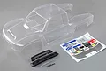 Clear unpainted polycarbonate body shell for Losi Super Baja Rey 2.0 RC truck, including decal sheet, black plastic trim parts, and small hardware.