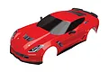 A red Traxxas 1/10 scale Chevrolet Corvette Z06 RC car body shell, pre-painted with black windows and trim, shown from a high-angle perspective.