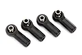 Four black Traxxas rod ends with pre-installed silver metal pivot balls arranged in a row against a white background.