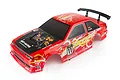 A red 1/10 scale RC car body shell with racing decals, carbon fiber hood pattern, and a black rear spoiler, isolated on a white background.