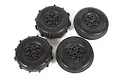A set of four Axial RC wheels, two with paddle-style tread and two with smooth tread, all mounted on black rims against a white background.