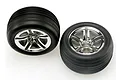 Two Traxxas 2.8-inch Alias ribbed front tyres pre-mounted on chrome twin-spoke wheels against a white background.