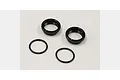 Two black metal shock adjustment dials and two black rubber O-rings for Kyosho RC cars.