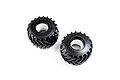 Two black Losi BKT monster truck tyres with white foam inserts inside, shown from an angled perspective against a white background.