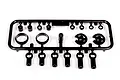 A black plastic parts tree containing various shock absorber components for an RC car, including rod ends, spacers, and spring retainers.