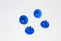 Four blue anodized aluminium cone-shaped wheel nuts for RC cars, shown from top and side angles on a white background.